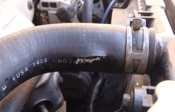signs of a bad radiator hose - torn or shattered